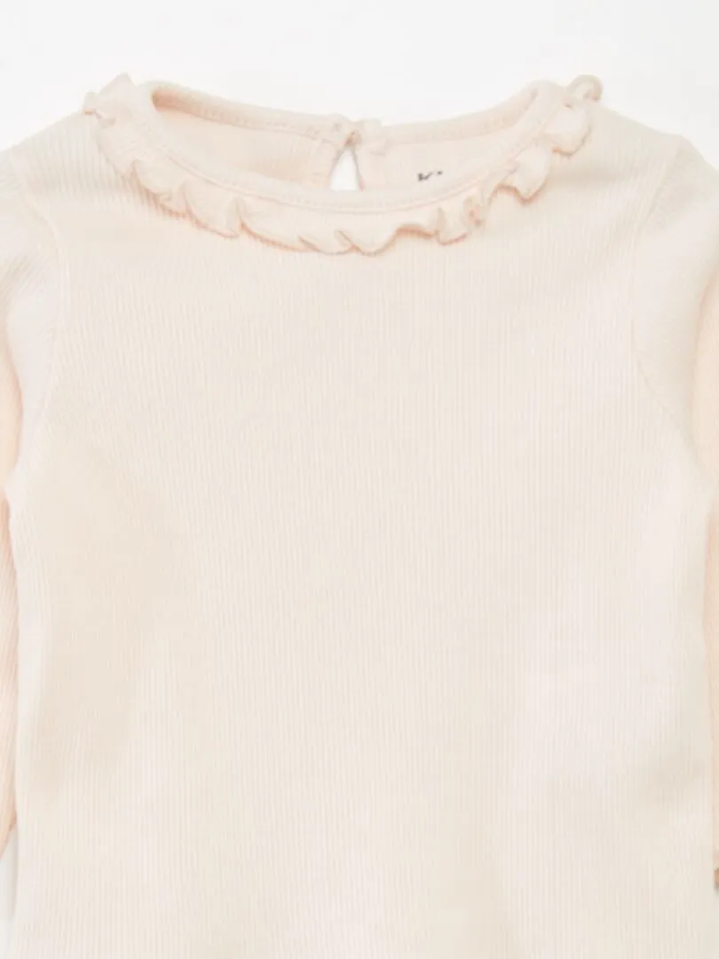 CAMISETA DE PUNTO DE CANALé CON VOLANTE EN EL CUELLO  ROSA